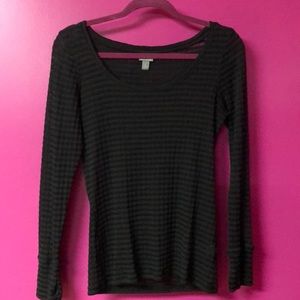 Long sleeve black shirt w/ thumb holes cut out.